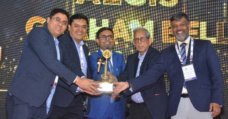 A winning team receiving the trophy at the 12th edition of the Aegis Graham Bell Awards